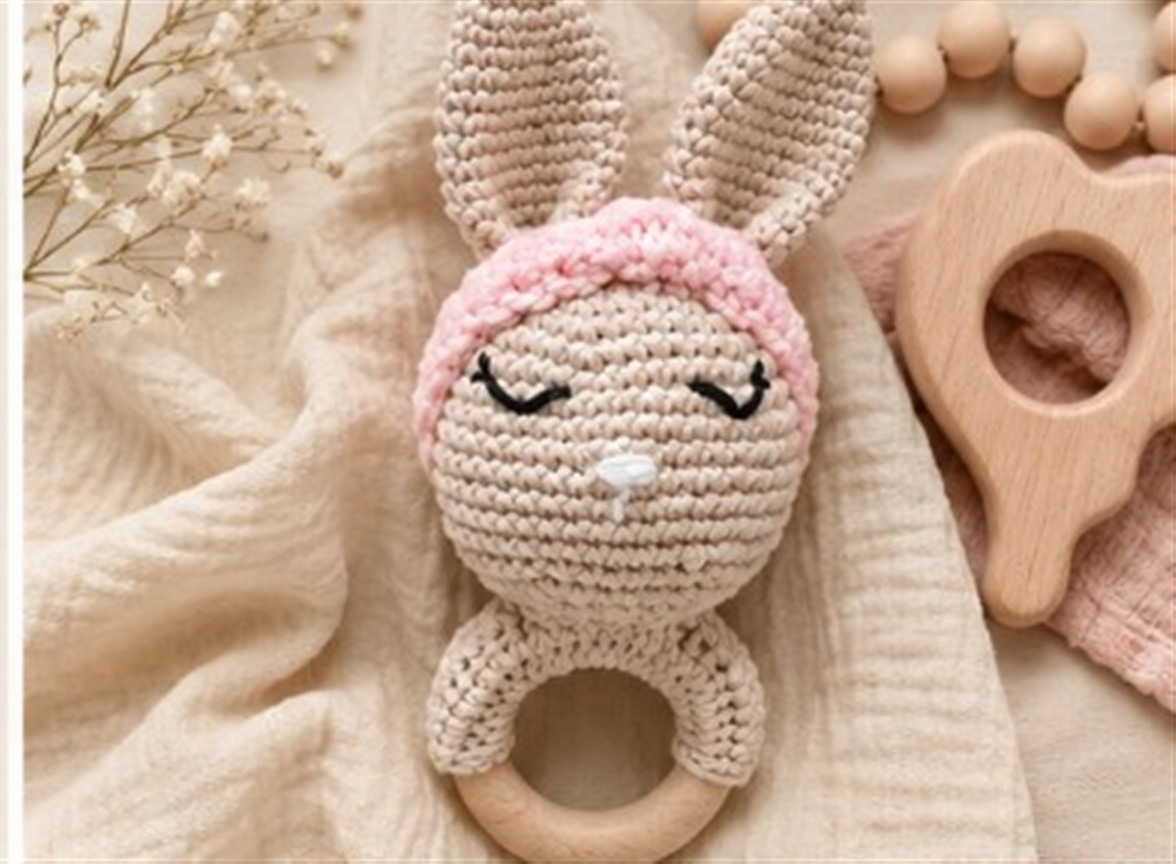 Handmade Snugli crochet bunny rattle — lifestyle